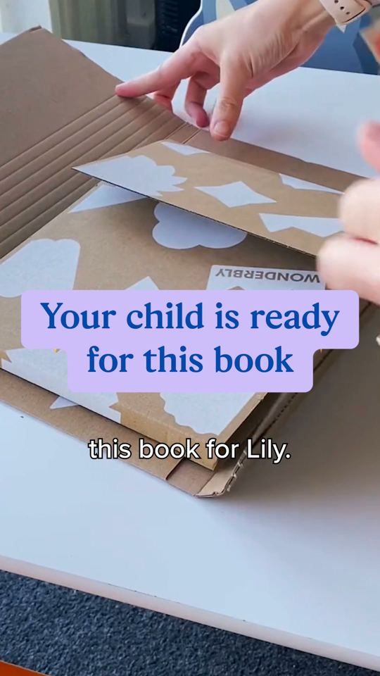 Hands opening a box with a big caption: Your child is ready for this book